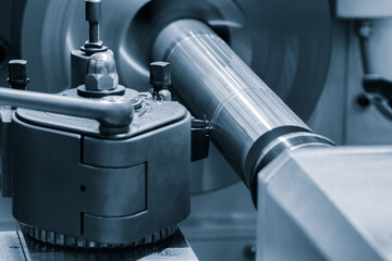 Poster - A lathe machine is grinding a piece of metal. The grinding wheel is spinning rapidly, and the metal is being shaped and polished. Concept of precision and control