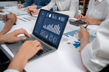 Fototapete - Analyst team uses BI Fintech display laptop to analyze financial data . Business people analyze BI software technology dashboard power for insights power into business marketing planning. Prudent
