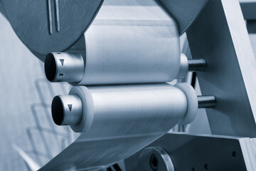 Poster - Fragment of the conveyor of sticking labeling machine. Abstract industrial background.