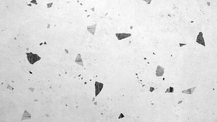 Poster - A white background with black and grey pieces scattered all over it. The image has a rough and gritty texture, giving it a sense of chaos and disorder