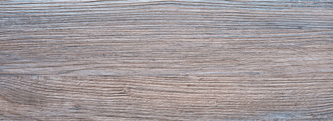 Poster - A wooden surface with a grainy texture. The wood is light brown and has a natural look
