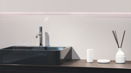 Poster - A black sink is placed on a counter next to a white vase and a white cup. The sink is clean and shiny
