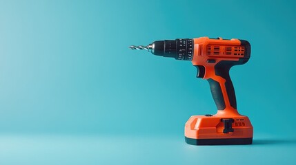 Poster - A drill placed vertically with its bit pointing downwards, on a solid blue background.