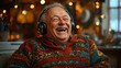 © melvilsky - Older man enjoying music while laughing in a cozy setting surrounded by warm lights and colorful decor