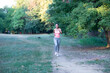 © Solid photos - Young woman jogging in the nature in summer