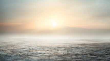 Wall Mural - Misty Sunrise Over Frozen Field: A Serene Winter Landscape