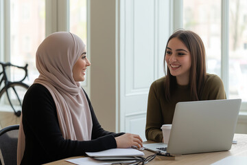 Aufkleber - Two businesswomen collaborating on project using laptop in office