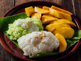 Mango sticky rice on wooden background