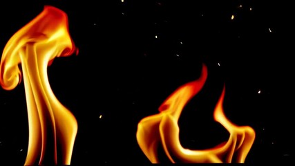 Poster - Flames dancing against a black background, abstract art. Energy and motion concept