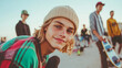 © Vivid_Vision - A young man with shoulder-length blonde hair, is smiling and holding his skateboard, capturing the essence of youth culture and social interaction between young people.