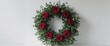 © LoFi J. - Charming wreath adorned with red roses and greenery for decoration