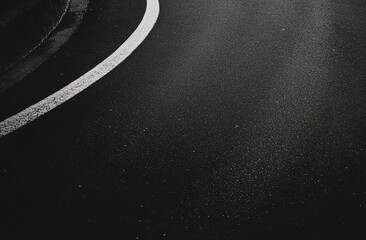 Poster - Black and white photo of a curved road with a white line.