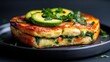 © senadlife - A stunning layered veggie omelette adorned with fresh avocado slices and spinach, creating a colorful and nutritious dish bursting with flavor and health benefits.