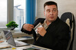 © diy13 - The man hides a flask of rum in his jacket pocket.. Businessman looking scared while taking a hip flask out of his jacket at work, hiding alcohol addiction issues of alcoholism in the workplace