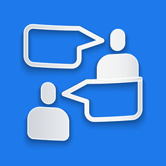 Poster - Paper cut Two sitting men talking icon isolated on blue background. Speech bubble chat. Message icon. Communication or comment chat symbol. Paper art style. Vector