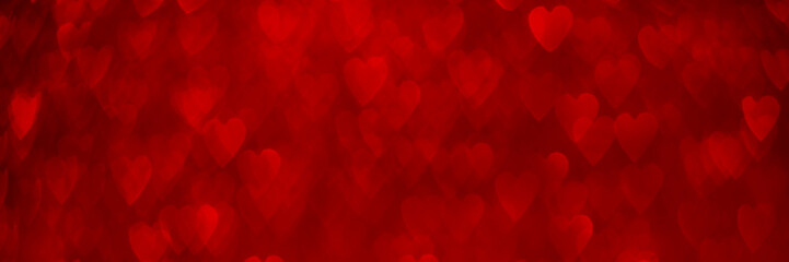 Wall Mural - Red hearts, sparkling glitter bokeh background banner, valentines day abstract defocused texture header