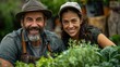 © Evon J - Middle age couple enjoying home gardening together in lush greenery