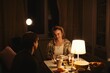 © amixstudio - Happy young couple in love celebrate Valentine's Day in their cozy apartment in subdued warm lighting