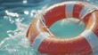 © StudioFF - Orange Life Buoy Floating in Sunlight / 日光の中で浮かぶオレンジ色の救命浮輪