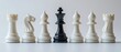 © Bassmallah - Black chess king standing out among white chess pieces.