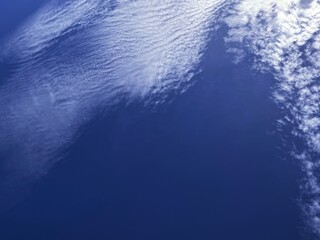 fluffy clouds in blue skies