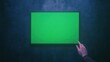 © ArtStockVault - Person Touching Green Screen Display in Dark Puzzle Escape Room Setting with Interactive Technology and Digital Integration Concept for Creative Escape Experience