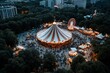 © Milos - A captivating bird's eye view of a bustling funfair, displaying colorful attractions, food stalls, and crowds enjoying the lively atmosphere of a community event.