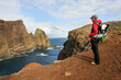 © robertharding - Young woman walking on Cevada islet, Sao Lourenco peninsula, Madeira island, Atlantic Ocean, Portugal