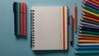 © Yusfa - Blank Spiral Notebook with Colorful Pens and Pencils: A Vibrant Art Supply Still Life