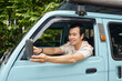 © DragonImages - Driver sitting in the van and driving
