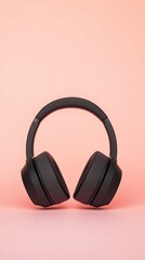 Poster - Modern black wireless headphones stand on a vibrant pink backdrop, creating a striking contrast and suggesting a focus on music, audio, or personal listening experience