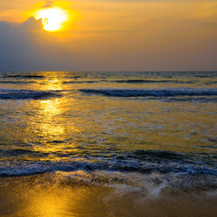 Poster - Bright golden sun rise over the tropical sea.