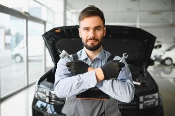 Leinwandbilder - Auto mechanic working in garage.