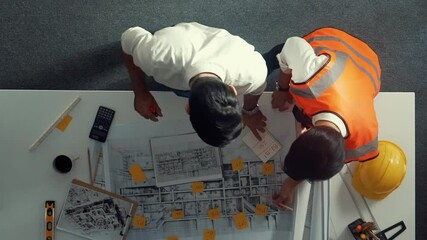 Poster - top view of smart architect and skilled civil engineer team working together to design building cons