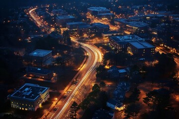 Poster - An aerial view of winding city streets glowing with car headlights at night