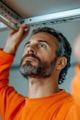 Aufkleber - Industrial Precision Mature Craftsman in Orange Workwear Assembles Metal Framework - Advanced Construction Techniques for Efficient Workflow in Modern Engineering