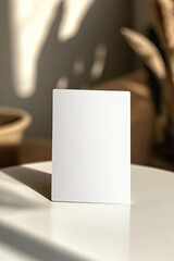 Poster - minimalistic close-up of blank auction bid card resting on white table inviting participation with copy space