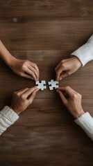 Leinwandbilder - Harmony in Diversity Close-Up of Diverse Hands Assembling Puzzle Pieces on Wooden Surface - Enhancing Cross-Cultural Collaboration for Digital Marketing and Urban Development Insights