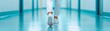 © Tanongsak idea photo - A person walks down a brightly lit corridor, wearing white pants and shoes, creating a calm and professional atmosphere.