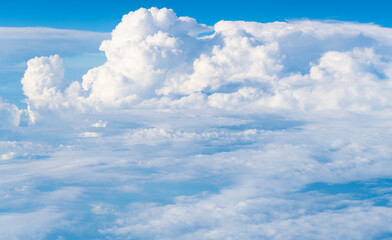 Wall Mural - Blue sky with clouds in the sky. Beautiful blue sky background with clouds.Natural and cloudy fresh blue sky background. White fluffy clouds in the blue sky.