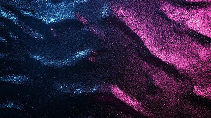 Poster - A vibrant display of blue and pink glitter on a dark background, creating a mesmerizing abstract texture.
