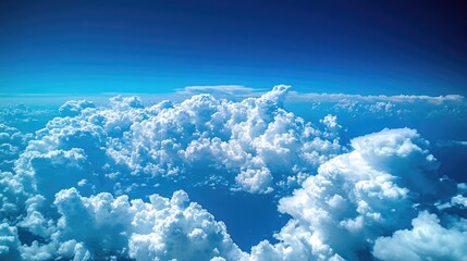 Poster - Cumulus cloud formations against a bright blue sky showcasing a striking contrast with fluffy white clouds and the deep atmosphere.