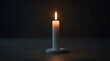 © Alex Pios - single lit candle on a dark table, symbolizing hope and remembrance