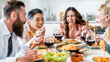 © charmedlightph - Happy friends having vegan pasta dinner party at home - Multiracial people drinking red wine at lunch break - Food and beverage concept with guys and girls dining together Italian food