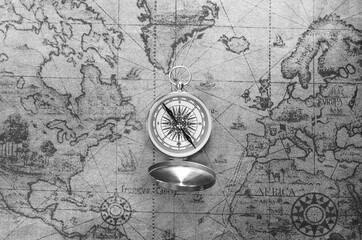 Wall Mural - classic round compass on background of old vintage map of world