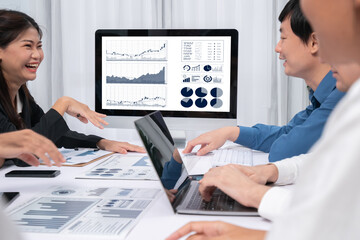 Fototapete - Analyst team utilizing BI Fintech to analyze financial data at table in meeting room. Businesspeople analyzing BI dashboard power for business insight and strategic marketing planning. Prudent