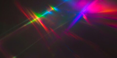 Wall Mural - vibrant rainbow light flares intersect on a dark background, creating an abstract, colorful design.