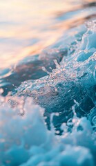 Poster - Close-up view of a transparent ocean wave splashing and creating intricate water droplets, illuminated by the warm golden light of a sunset, showcasing the beauty and power of nature