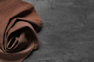 Wall Mural - Brown napkin on black grunge background