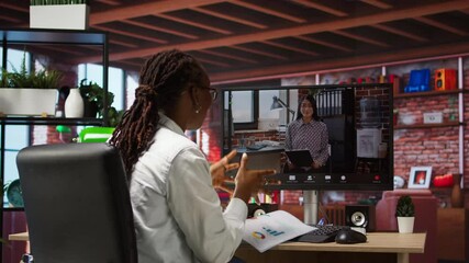 Poster - Woman at home answering videocall from manager checking tasks progress, showing documents, presenting progress done. Teleworker in videoconference with team leader, talking about paperwork, camera A